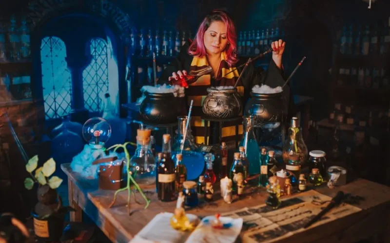 A woman in a magical lab creates potions with cauldrons, bottles, and spellbooks.
