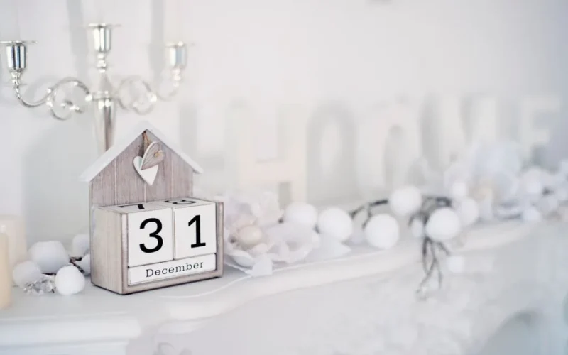 Charming holiday-themed decor featuring a December 31st calendar and white ornaments.
