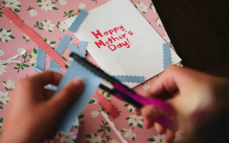 Creative Mother's Day card crafting with floral paper and scissors
