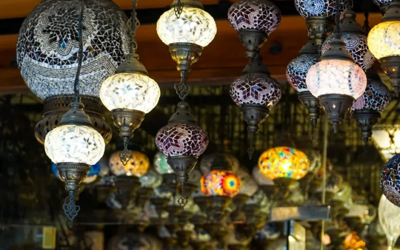 Stunning display of traditional Turkish mosaic lamps in a vibrant Istanbul market.