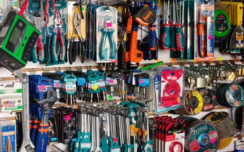 A comprehensive display of diverse hardware tools including pliers, screwdrivers, and wrenches in a store.