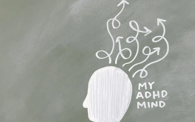 Creative depiction of the ADHD mind with chalk arrows on a green board.